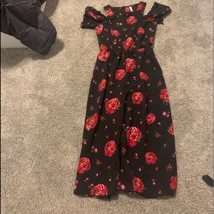 Black jumper with red roses.